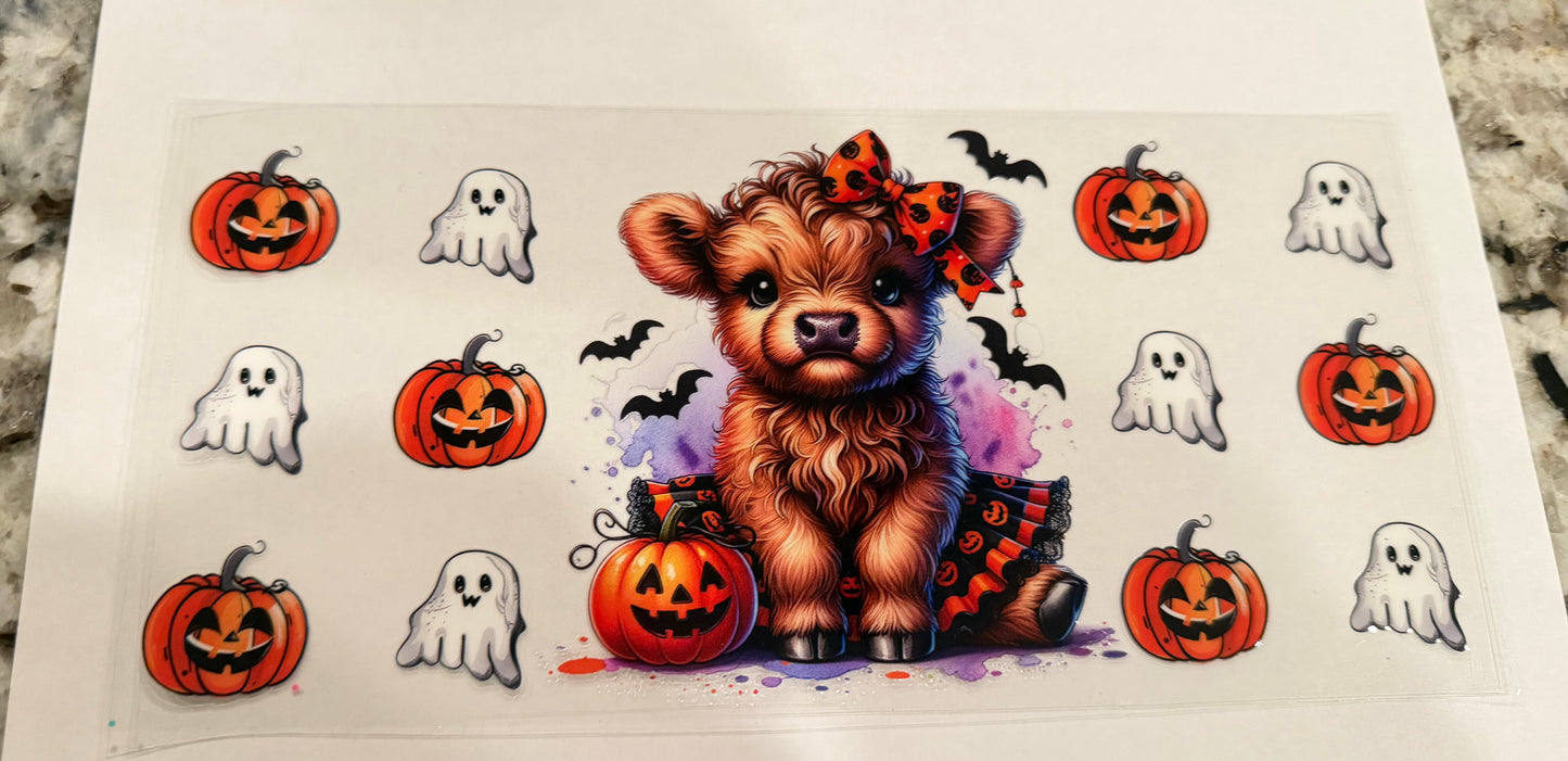 Cow with pumpkin and ghost