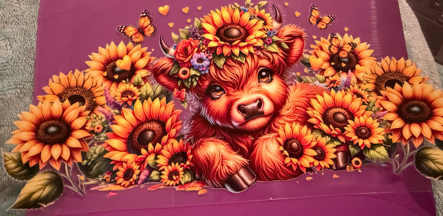 Cow with sunflowers