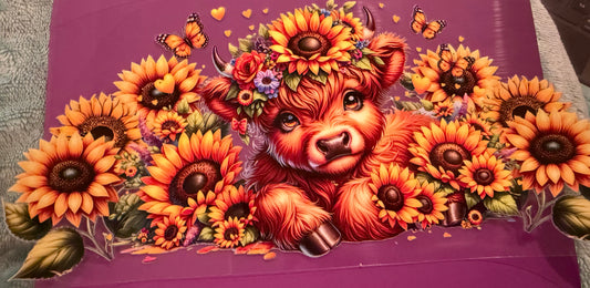 Cow with sunflowers