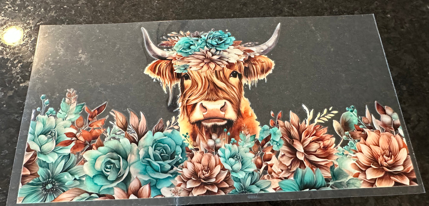 Cow with blue flowers
