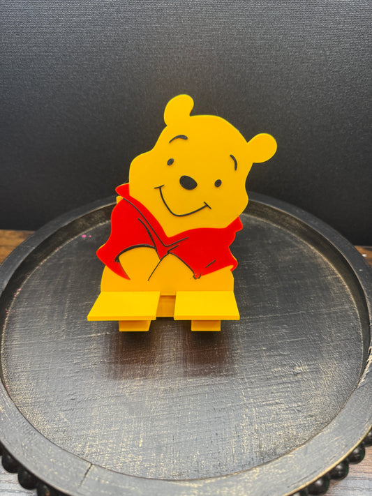 Pooh phone stand with charger slot